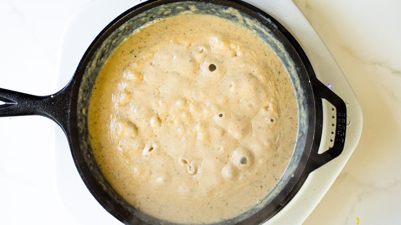 simmering gravy in skillet