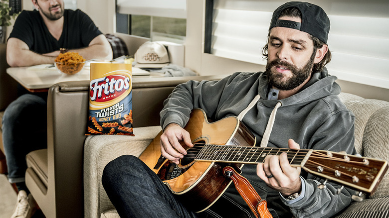 Thomas Rhett playing guitar