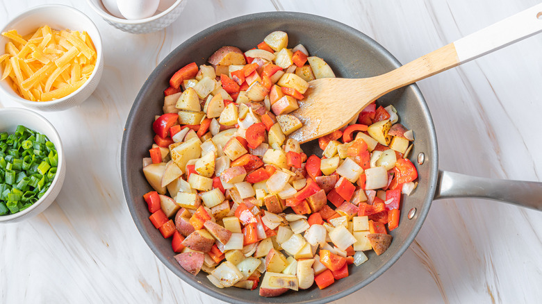 cooking peppers and onions