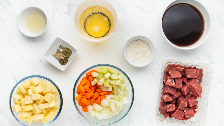 Beef stew ingredients in bowls