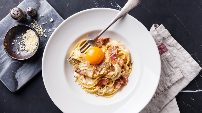 Carbonara with an egg yolk on top