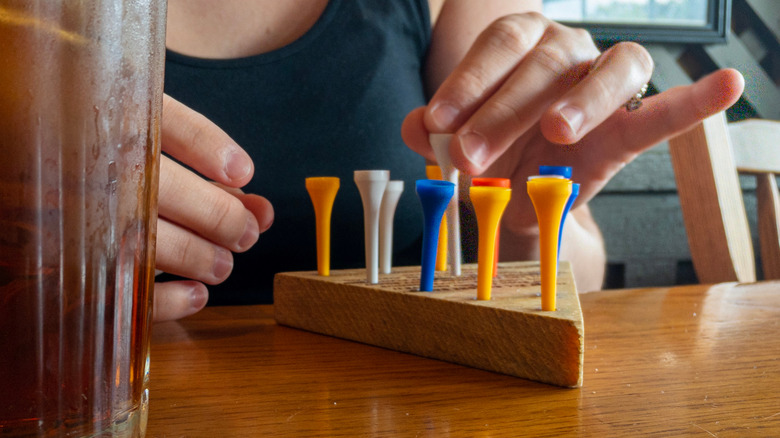 Cracker Barrel customer playing peg game