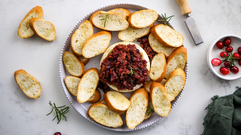 cranberry bacon baked brie with crostini