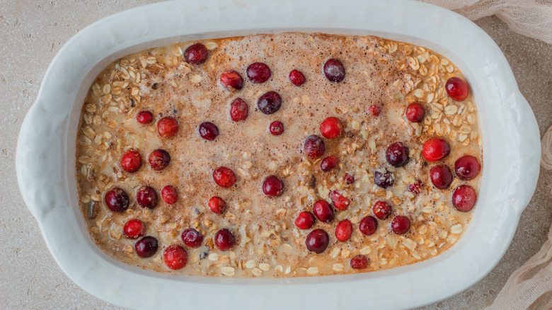 milk, oats, and cranberries in dish