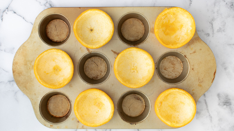 orange peel cups in muffin tin