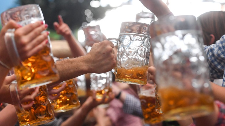 beer glasses being lifted