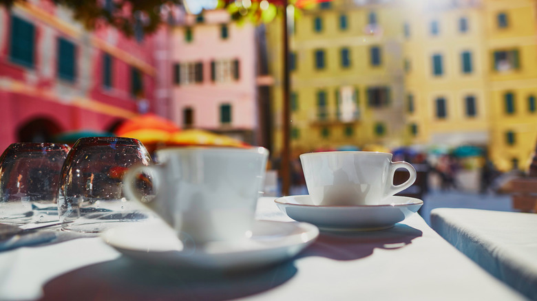 two espresso glasses on table at outdoor cafe