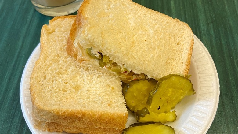 Cream cheese and olives on white bread