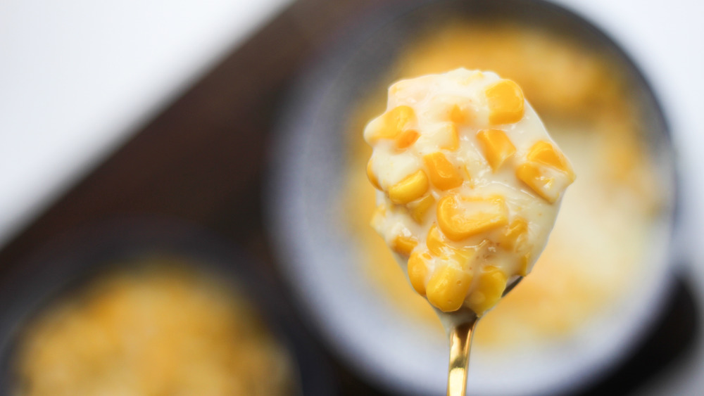 creamed corn being spooned