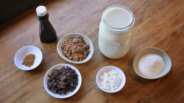 vegan hot chocolate ingredients on wooden table