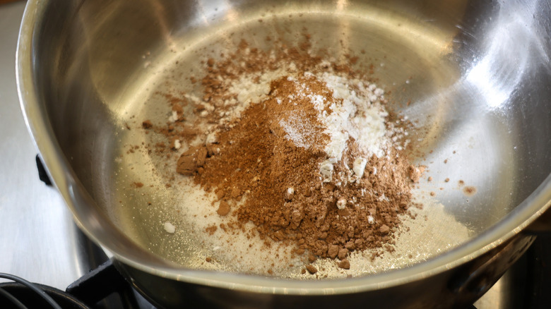 cocoa powder and cornstarch in steel saucepan