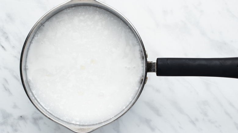 rice cooking in saucepan