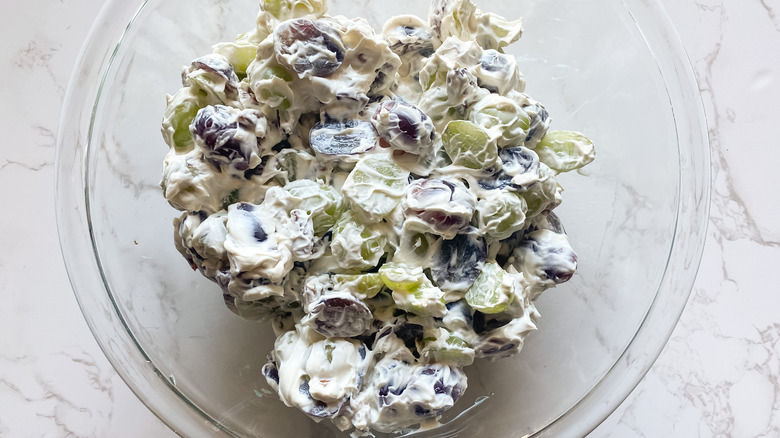 Creamy grape salad with grapes in bowl 