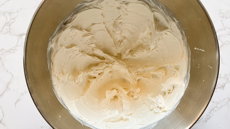 Creamy the cream cheese for the grape salad mix in bowl