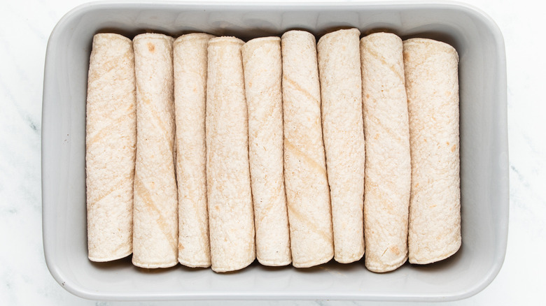 rolled enchiladas in baking tray