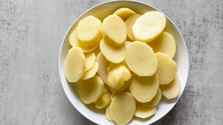 sliced potatoes in a dish 