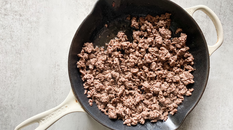 ground beef cooking in a pan