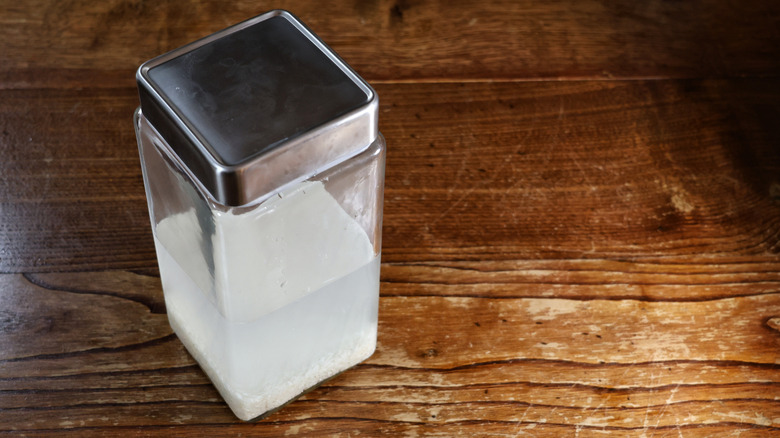 container of rice and water