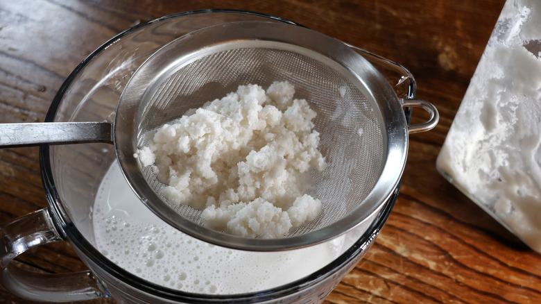 pulverized rice in sieve over bowl