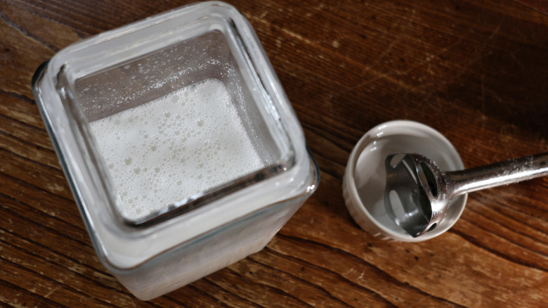 glass container of horchata with blender