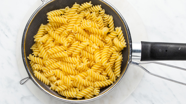 pasta draining in collander