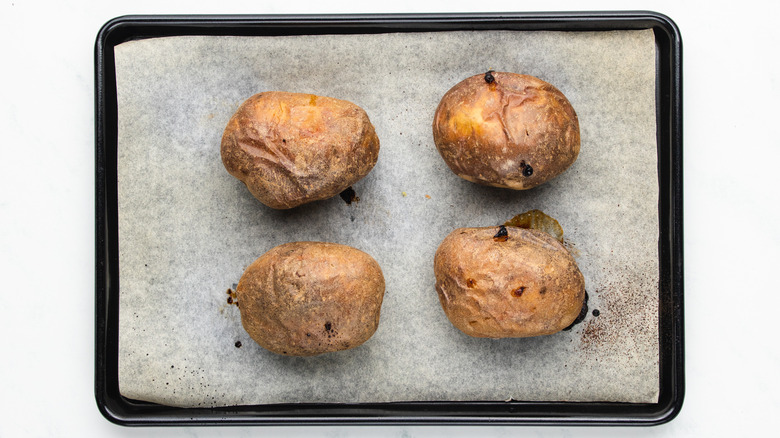 baked potatoes on baking sheet