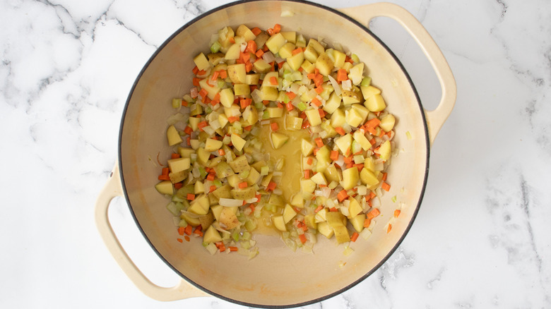 sauteed veggies and potatoes in dutch oven