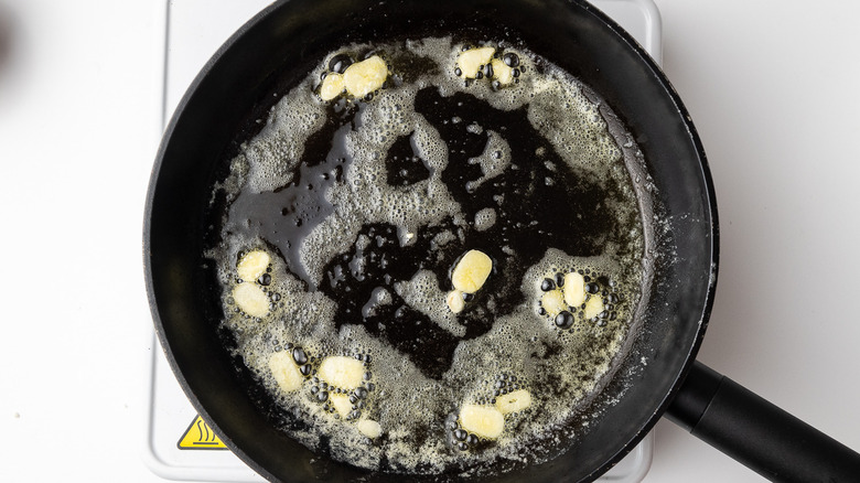 garlic and butter in skillet