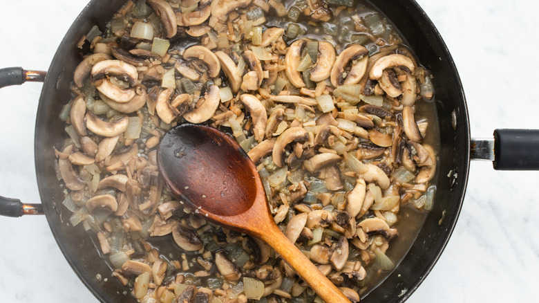 mushrooms and wine in pan 