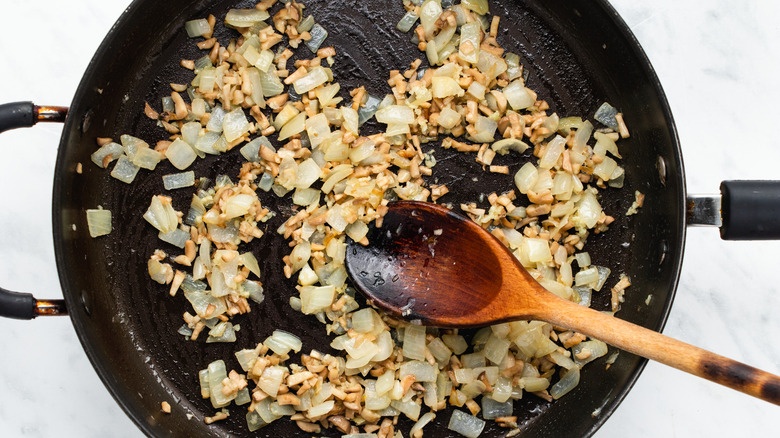 onions mushrooms garlic in pan