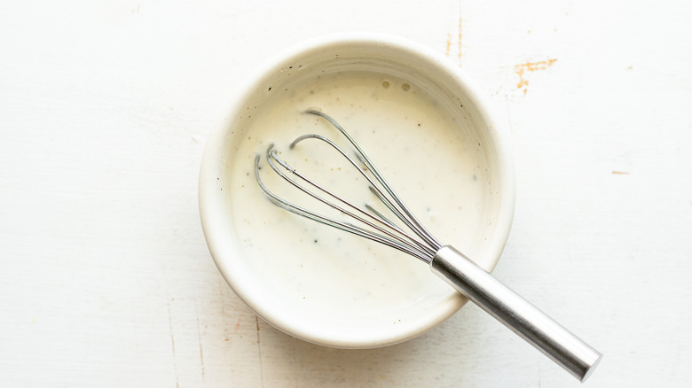 yogurt and lime dressing with a whisk