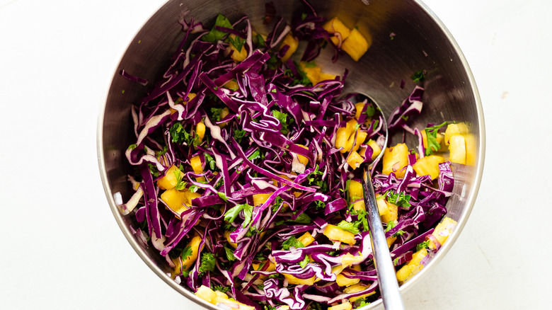 shredded cabbage, diced pineapple, minced onions in bowl