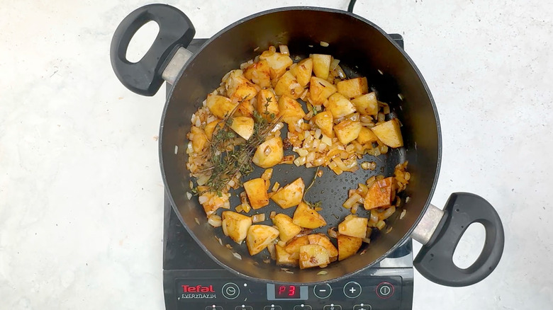 potatoes, thyme, smoked paprika in pan