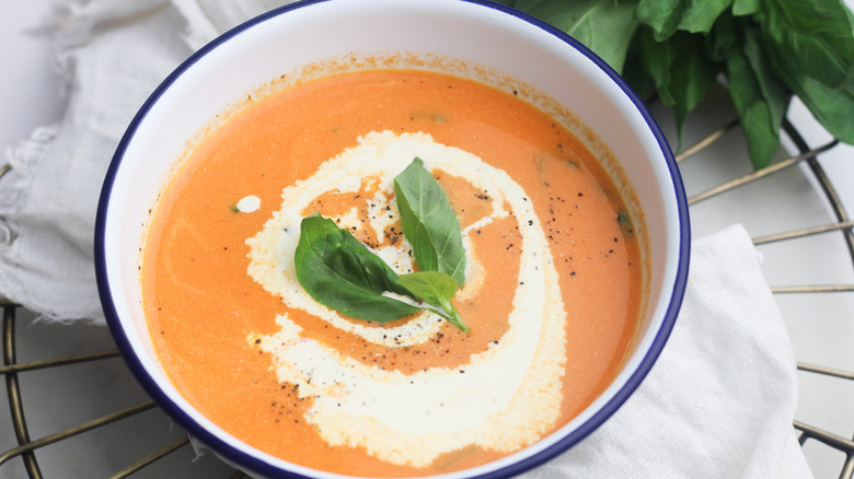 Tomato soup topped with fresh basil