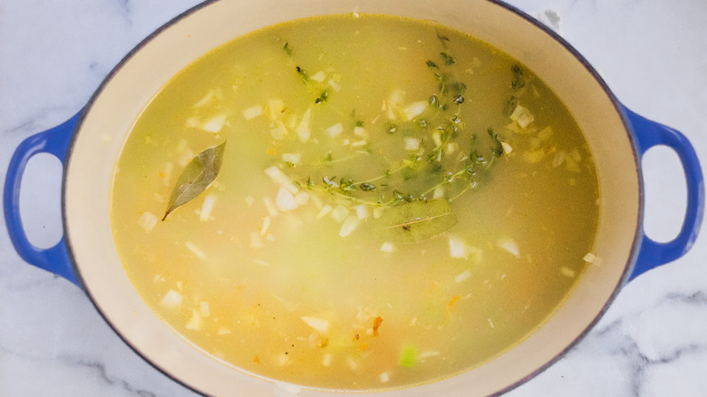 Broth and herbs mixed into the soup