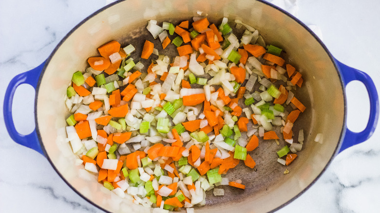 Onions, carrots, and celery in a Dutch oven