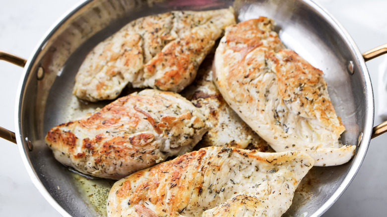 seasoned chicken in metal pan