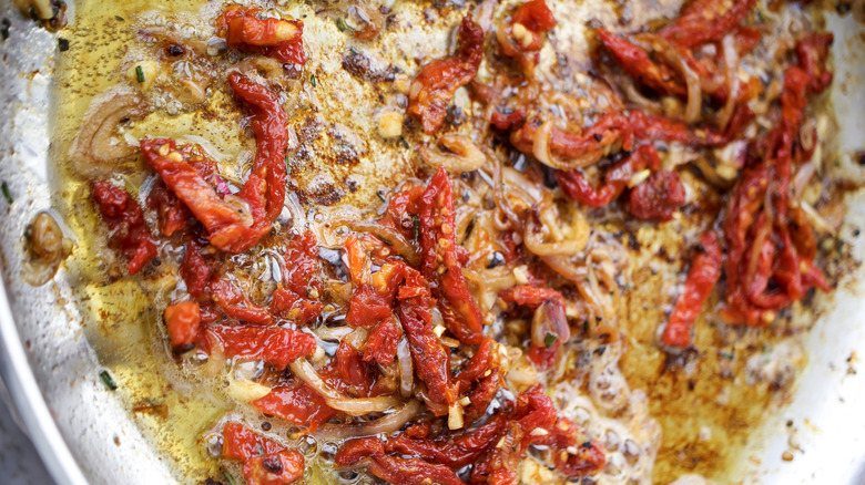 sun-dried tomatoes cooking in oil