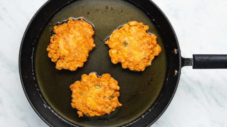 corn fritters in pan 