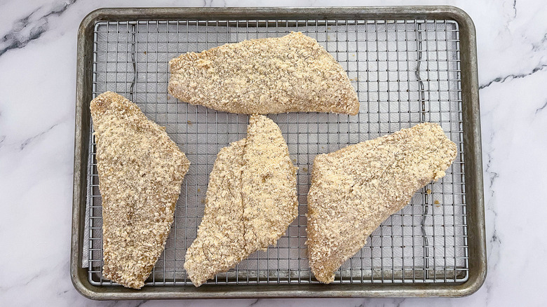 breaded raw catfish on rack