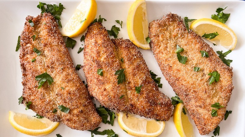 fried catfish with lemon wedges