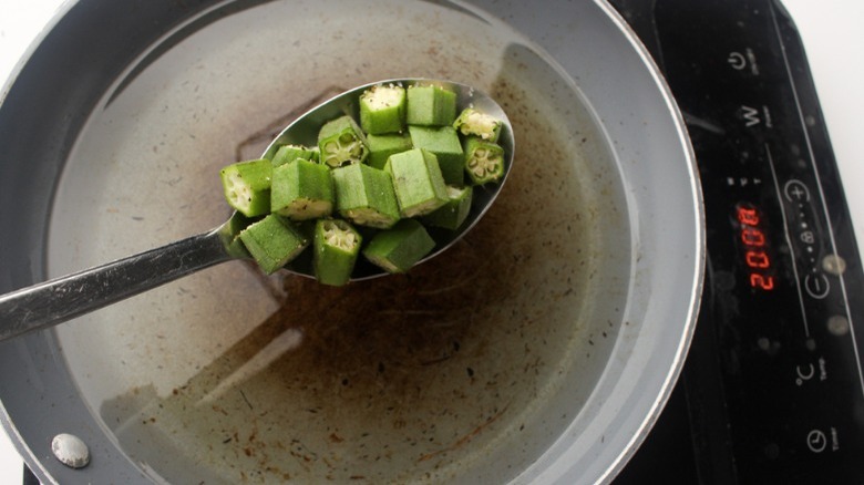 spoon holding okra slices