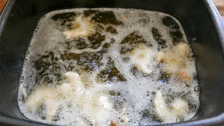 frying the battered shrimp