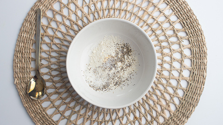 white bowl with flour coating