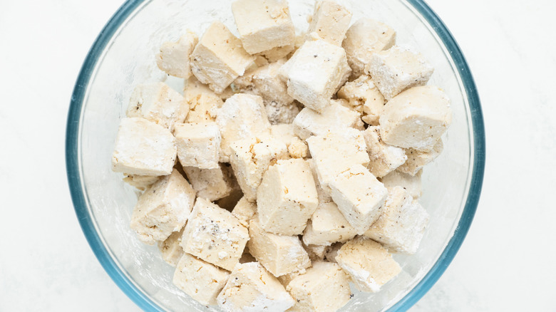 tofu and cornstarch in bowl