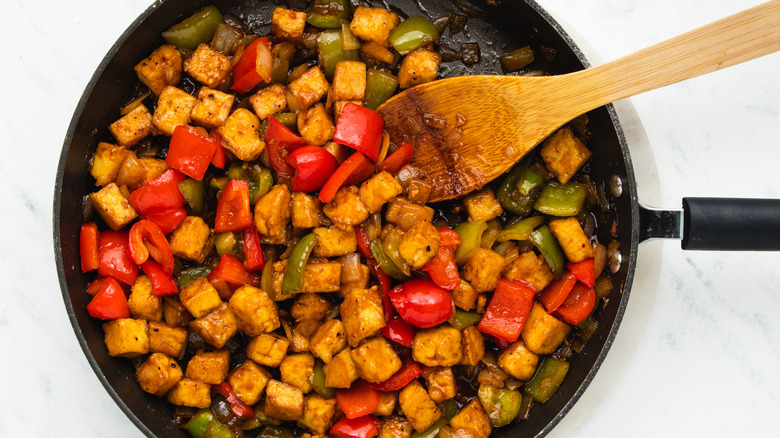 Tofu and peppers in pan