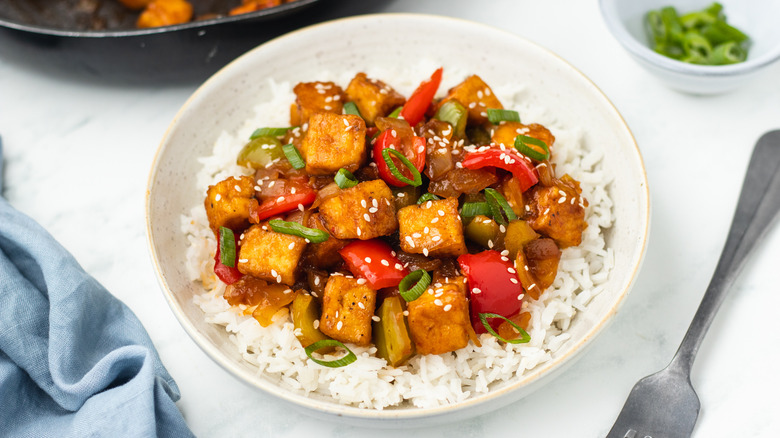 Kung pao tofu in a bowl with rice