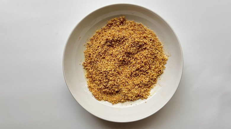 dry couscous in white bowl