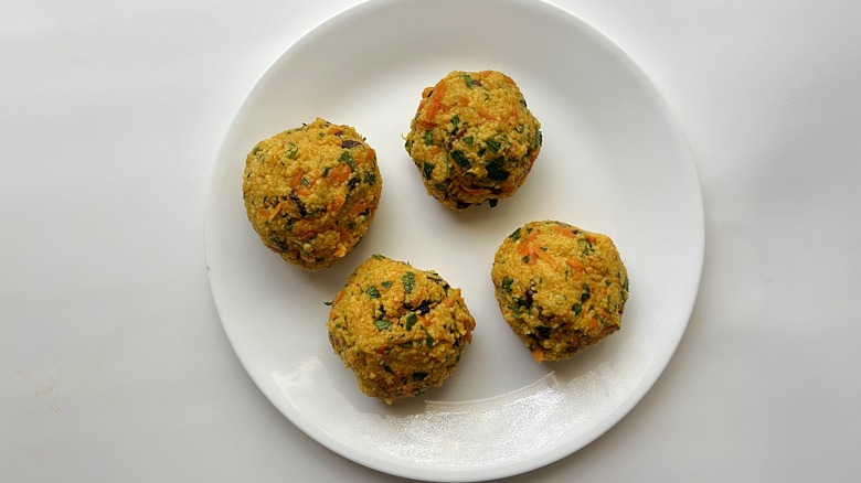 couscous balls on white plate