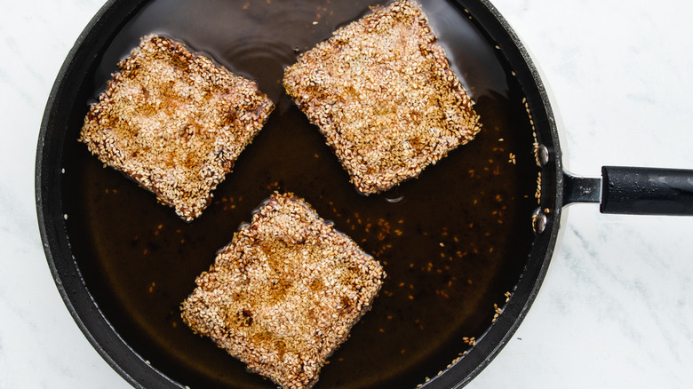 shrimp toast frying in pan